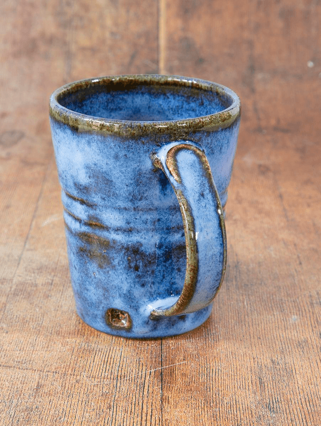 Straight sided coffee mug in blue and brown