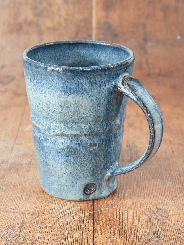 Straight sided coffee mug in flowing light blue