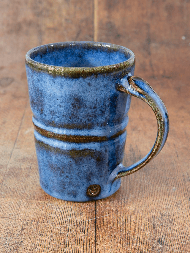 Straight sided coffee mug in blue and brown