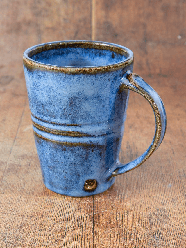 Straight sided coffee mug in blue and brown
