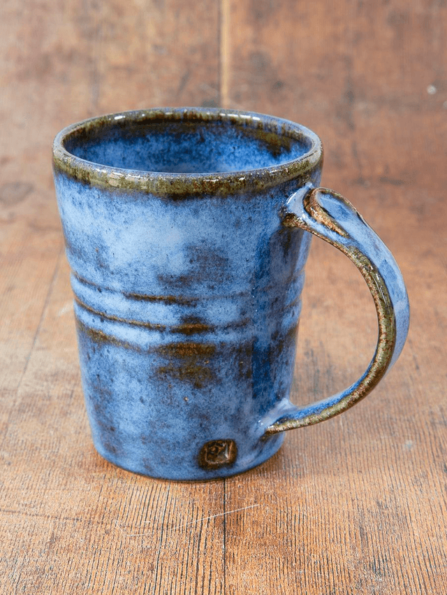Straight sided coffee mug in blue and brown